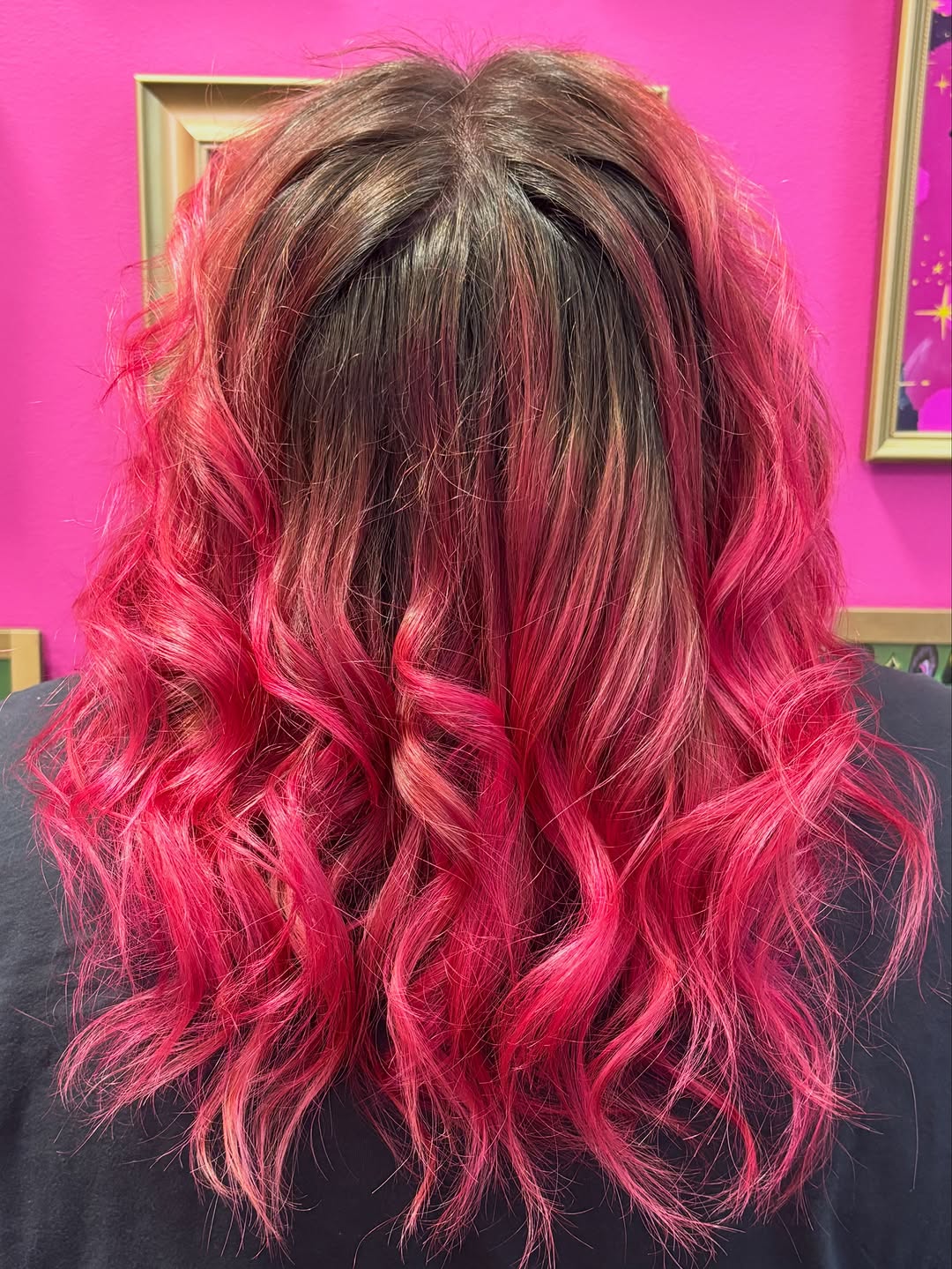 Pink hair color melt from natural roots, back view